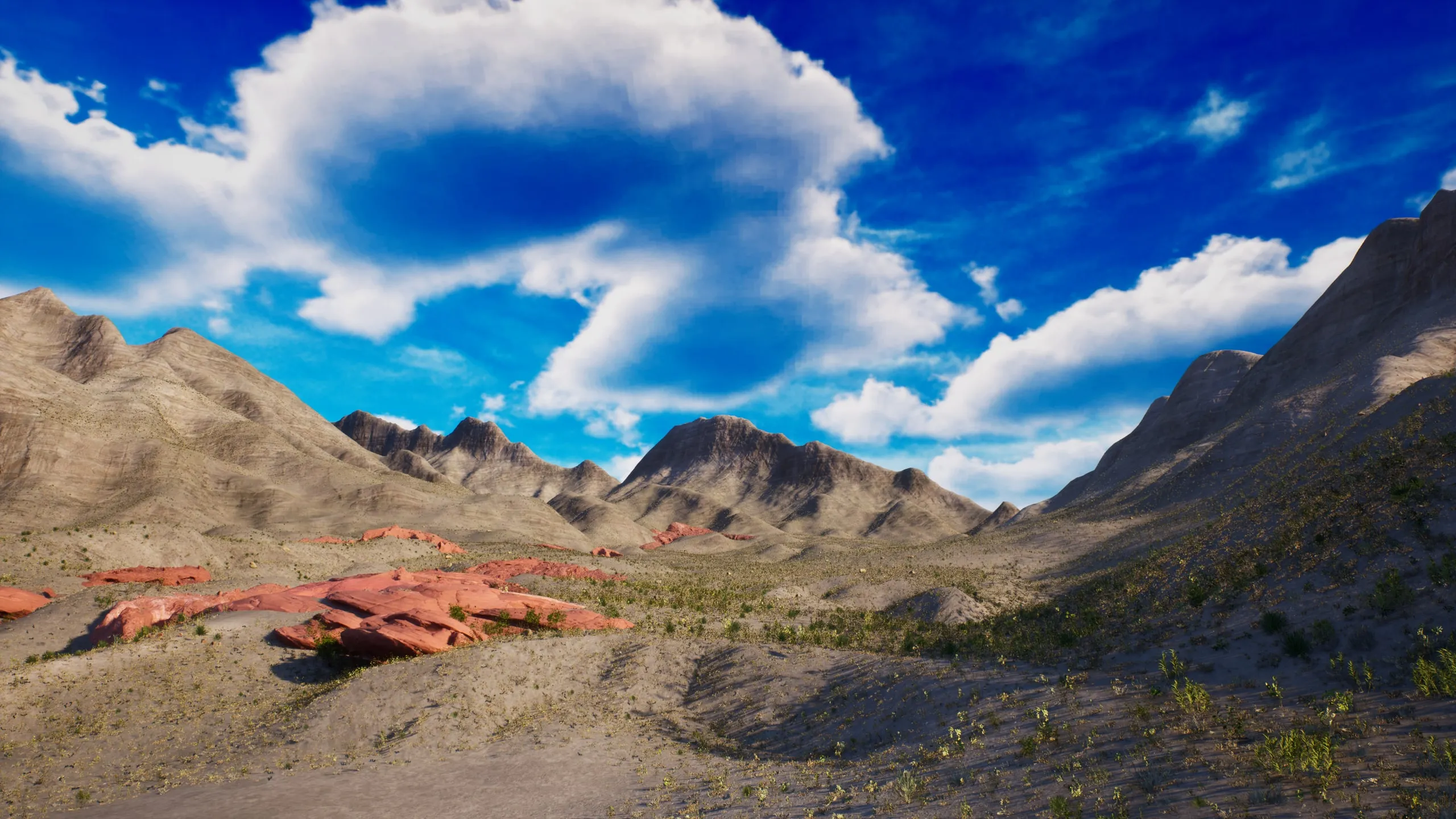The valley floor and red rock under the peaks